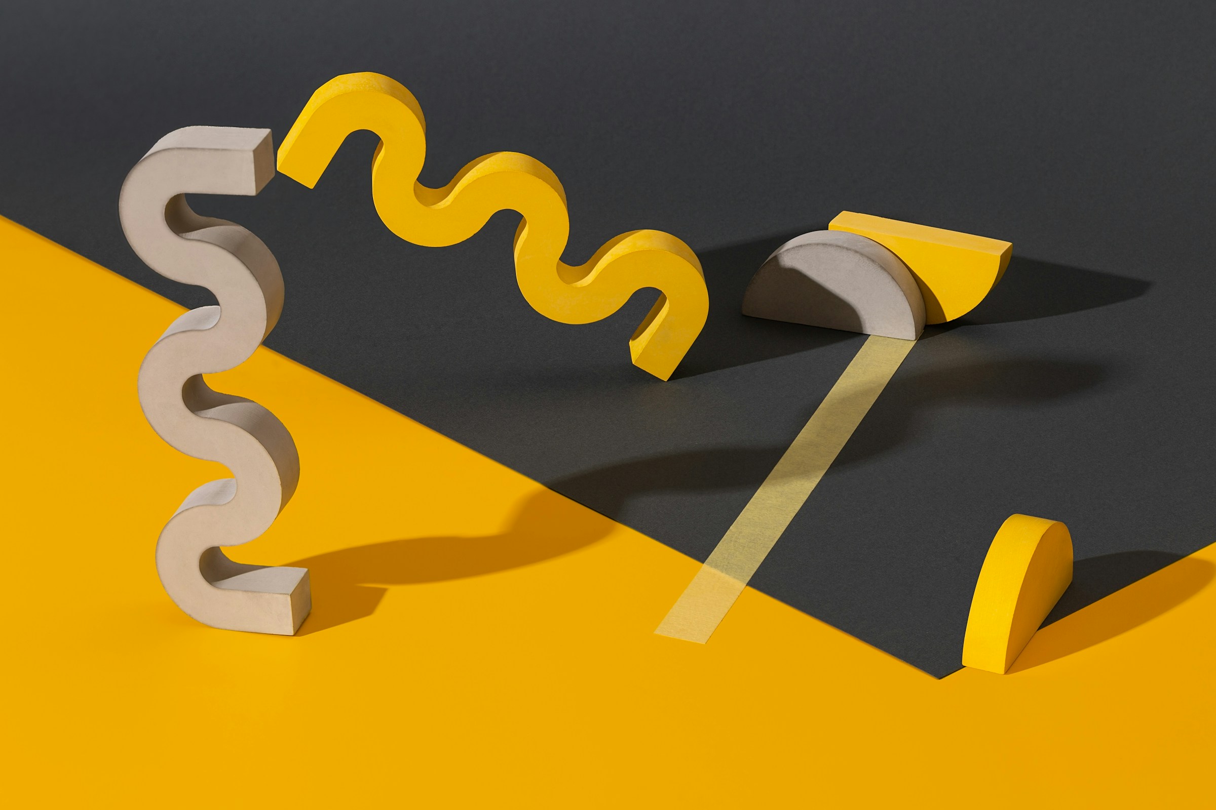 Yellow ribbon and tools on a dark surface